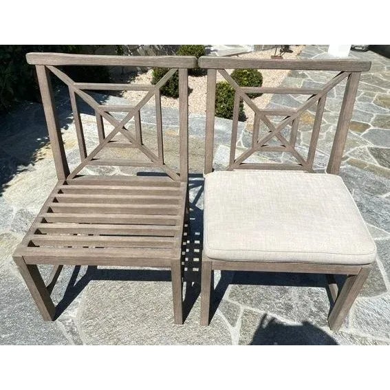 This pair of teak outdoor dining side chairs, by Restoration Hardware's Saltram Collection, is a design adapted from the...