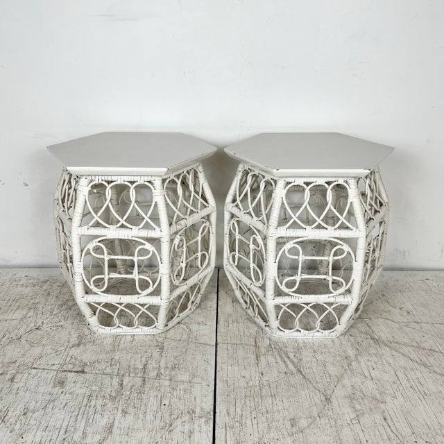 Vintage pair of white chinoiserie rattan drum shaped garden stools/side tables. Hexagonal laminate and wood tops on...