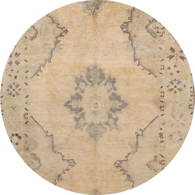 A hand-knotted vintage Khotan rug with an all-over design. This piece has great detailing and colors. It would be the...