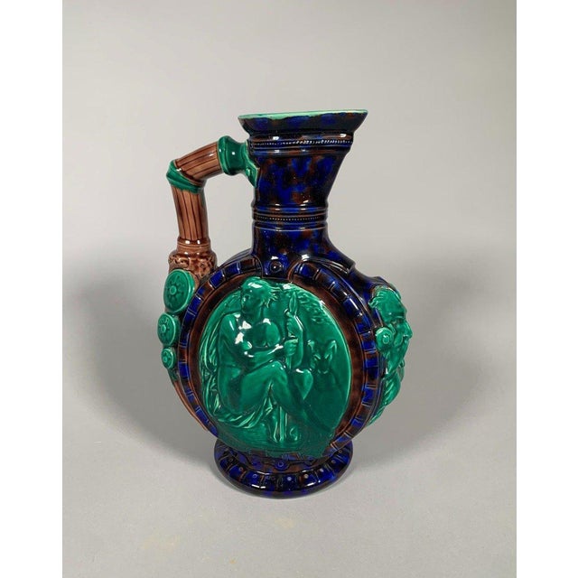 Albert Ernest Carrier-Belleuse (1824-1884) ceramic ewer. The ewer is decorated on one side with a male nude leaning on a...