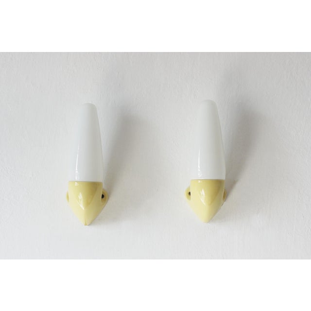 A unique pair of minimalist wall sconces, designed by Stig Carlsson for the Swedish manufacturer Ifö—a brand renowned for...