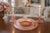 A beautifully coordinated vintage pink Depression glass set featuring a wide, shallow centerpiece bowl paired with two...