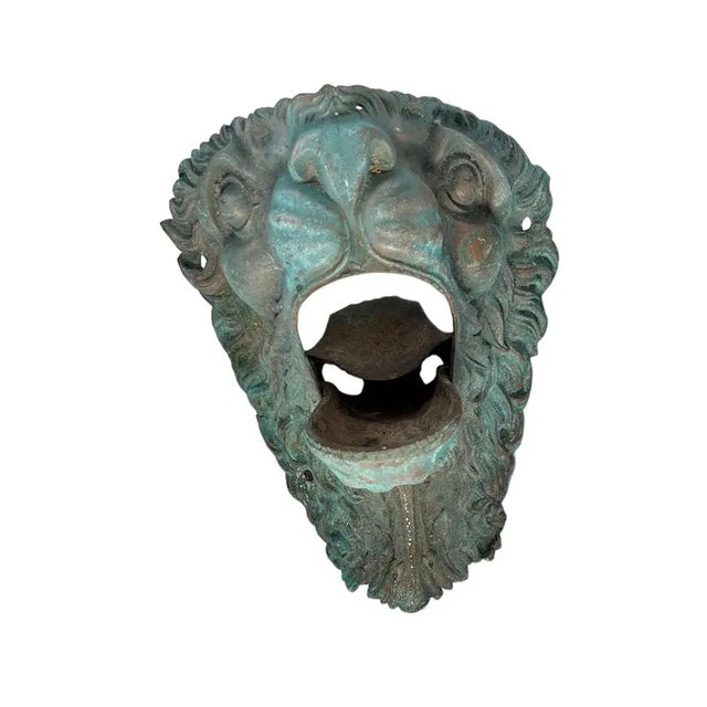 A bronze billiard, or pool pockets in the form of lion mask now mounted on black metal bases. France, circa 1890.
