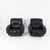 A pair of lounge armchairs with a fully upholstered frame and black leather upholstery. The seat, backrest, and armrests...