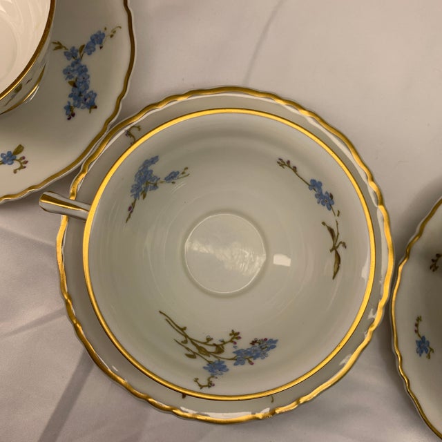The items featured are fine porcelain teacups and saucers in the Montméry pattern produced by Theodore Haviland Limoges in...