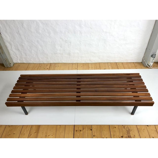 Wooden slatted bench from the Wiener Werkstätten, 1960s. 9 rectangular, dark brown wooden slats (sapeli wood) on black...