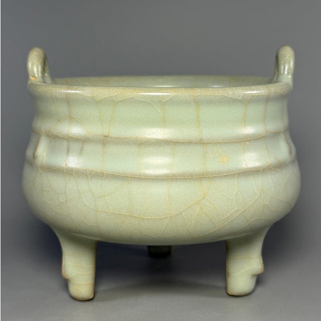 Beautiful antique Chinese Longquan celadon tripod censer with two side handles. Fine crackle glaze, elegant shape, good...