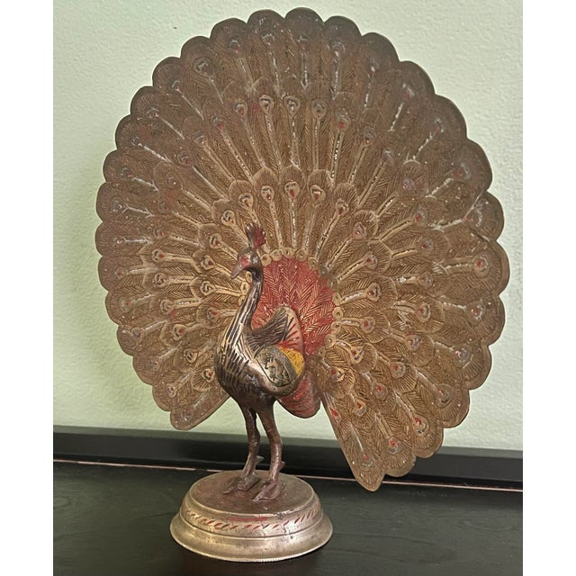 Incredible craftsmanship on display with this lovely polychrome brass peacock. Add a touch of whimsy to your shelves!...