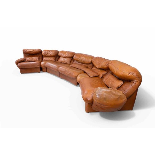 Vintage sofa set realized in 1970s in the style of Vico Magistretti. Original vintage leather upholstery. 2 modules in...