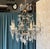 Add a touch of timeless Parisian sophistication to your home with this elegant French glass and crystal chandelier from...