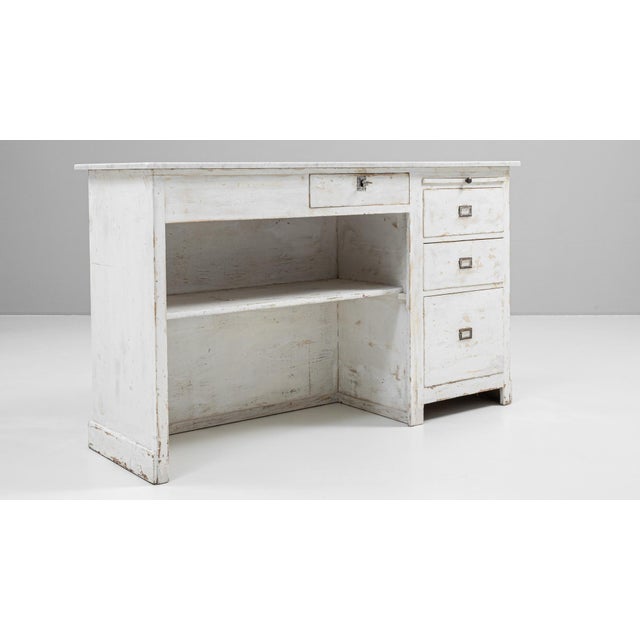 This early 20th-century French shop counter features a white patinated wooden frame and a solid marble top, offering both...