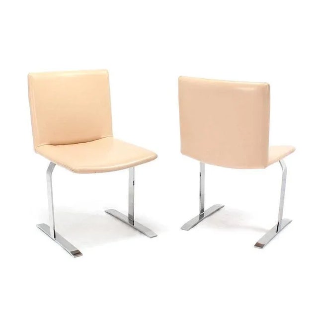 Set of nice Mid-Century Modern chairs on chrome bases with vinyl upholstery.