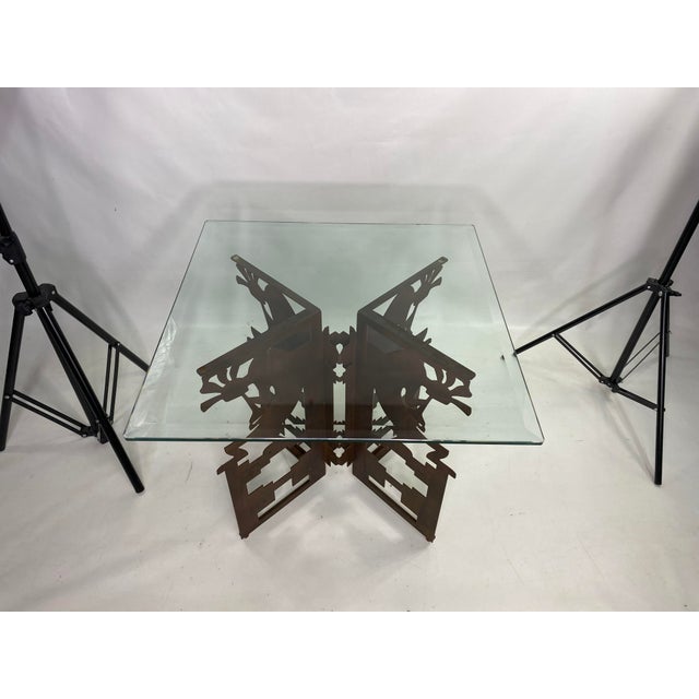 Bronze Colored Base with cut out Native American design with glass top with slight scratches and bigger scratch as pictured.