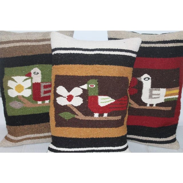 This fun group of weaving pillows have the initial E on them and are all have cotton linen backings. Down and feather...