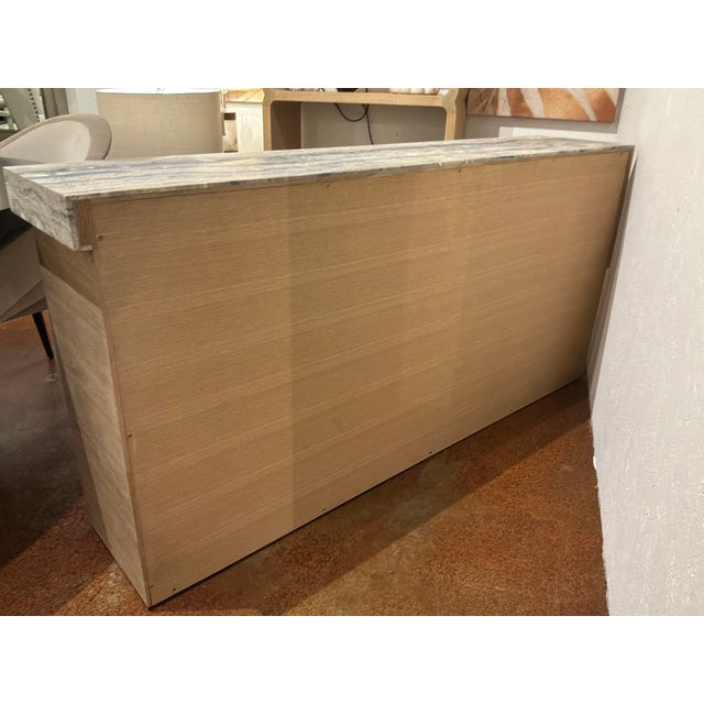 Stylish Baker Resort Tropez Console Table. Sculptural gray, beige and ivory travertine marble. Unfinished wood sides. AS...