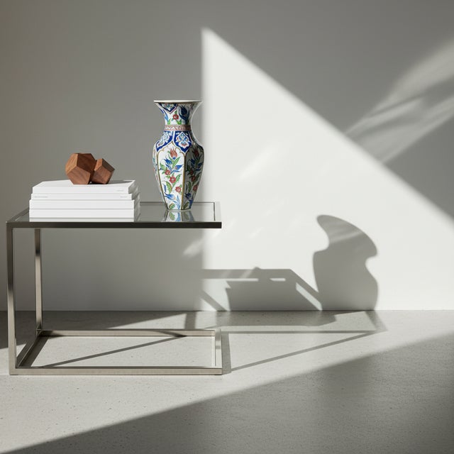 A Pavilion in Porcelain: The Arched Faceted Vase ️ This Handmade Ceramic Vase is a masterclass in structure. Standing at...