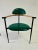 These Italian stitched green leather chairs with natural wood armrests and steel frame by ARRBEN ITALIA. Four chairs are...