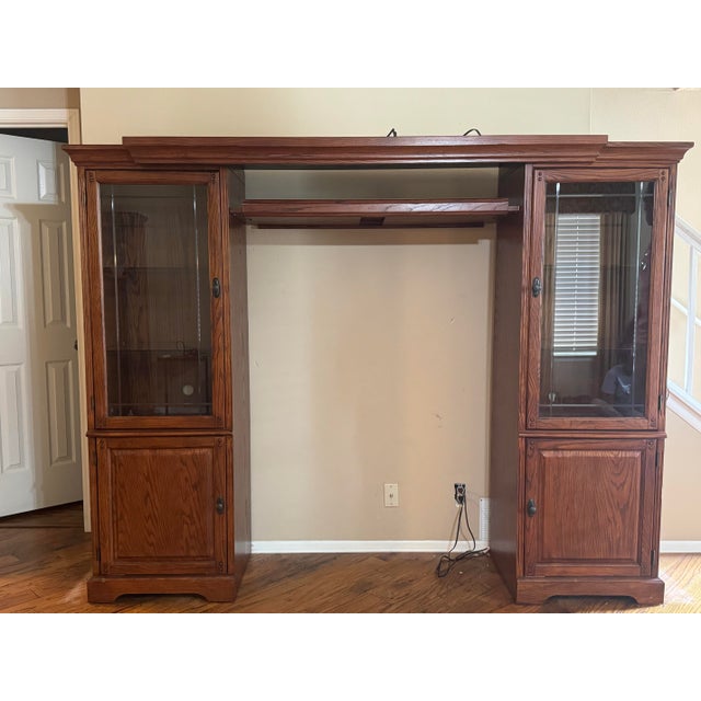 Adjustable Adjustable solid oak entertainment center/wall unit in good condition. Features include: • Solid oak...