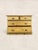 A charming antique English pine chest of drawers dating to circa 1900. Crafted from solid pine, this piece features a...