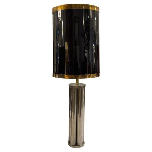 A fine tall desk lamp designed by Maison Jansen from France circa 1950. Nickel plated steel with the original black...