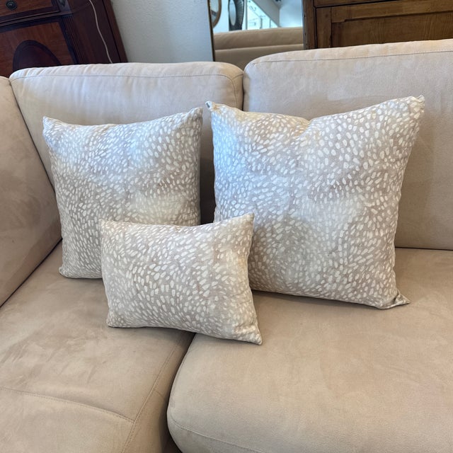 Design Plus Gallery presents a Set of Three Speckled Pillows in Taupe/Fawn by Rebecca Atwood. This set includes two square...