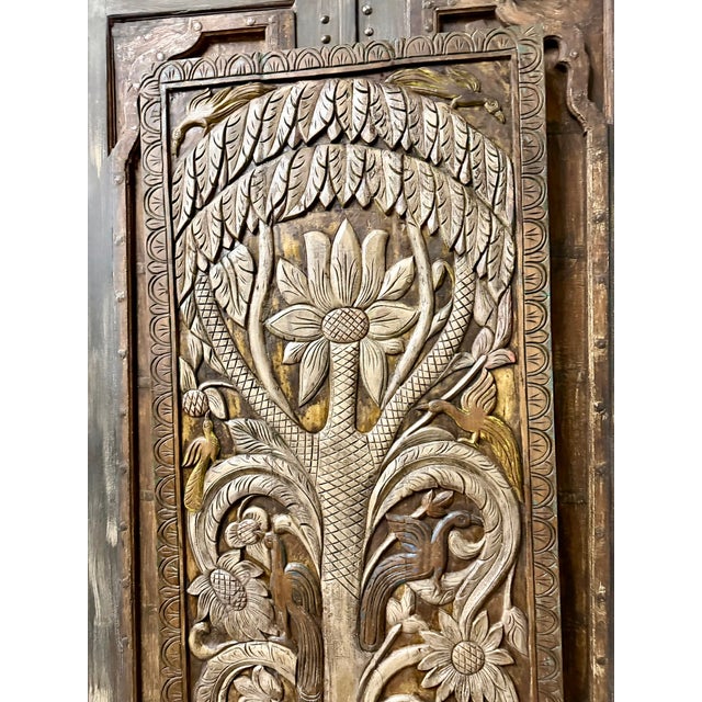 Invite timeless beauty and positive energy into your space with this vintage carved Tree of Life barn door, a stunning...