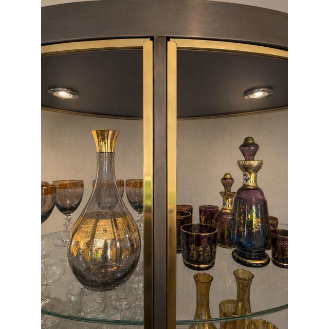 These striking Design Institute America Series 74 BH21 illuminated display cabinets feature a sophisticated gunmetal-toned...
