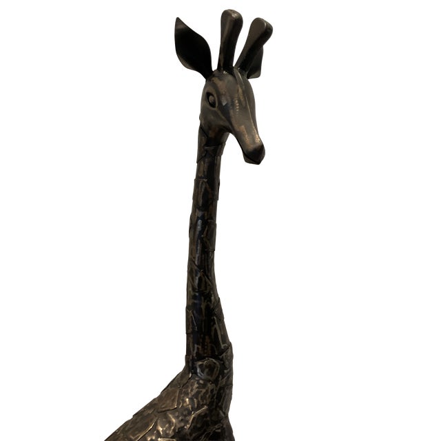 Make a bold statement with this striking vintage Brutalist giraffe sculpture, a tall, hand-crafted metal piece that...