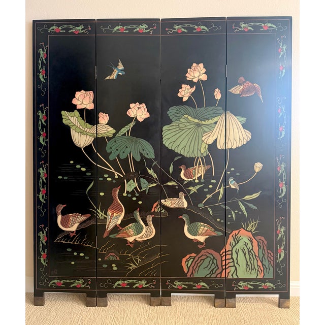 A beautifully crafted vintage Chinese carved lacquer folding screen featuring an elegant lotus pond scene with colorful...