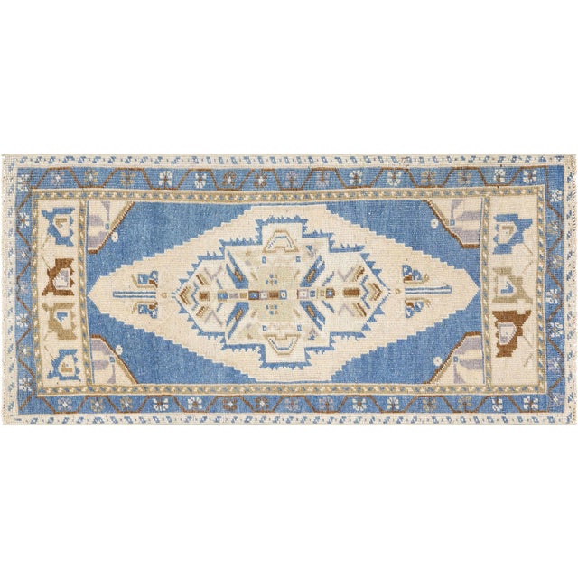 This Vintage Turkish Oushak Yastic measures 1'11" x 4' and is a unique addition to any room. Crafted with traditional...