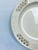 This Royal Creamware charger has a diameter of 12 1/4”. There is a wide border of four reticulated sections and four in...