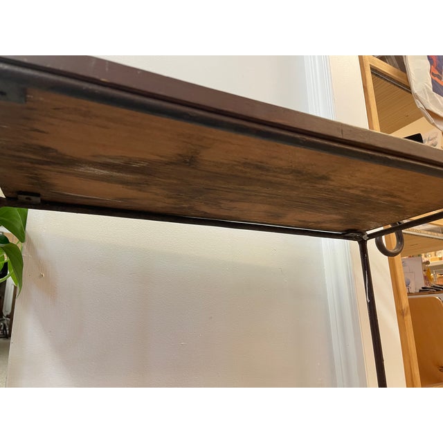 Brown 1970s Vintage Hand-Carved Wood and Wrought Iron Console Table With Tribal Motifs and Scrollwork Arms For Sale - Image 8 of 11