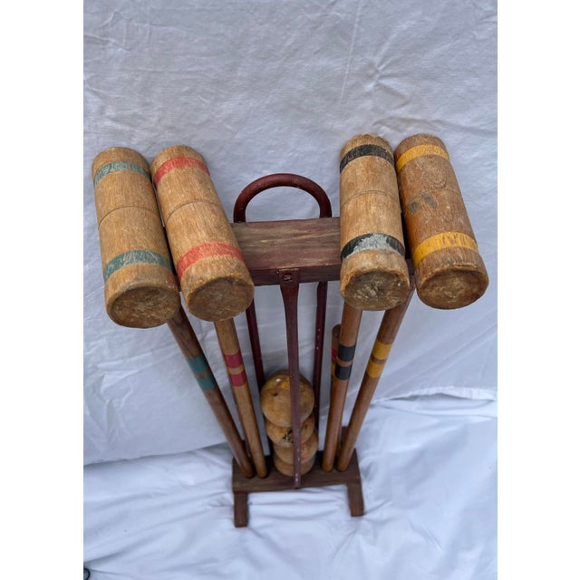 1950’s croquet set in a wooden and metal stand. Included is 4 mallets, 2 stakes and 4 balls. Very cool and unique piece to...