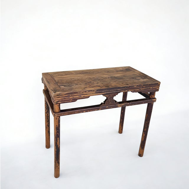 This rectangular side table is made from solid elm wood, featuring a multi-layered, molded edge on the tabletop. The frame...