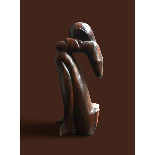 Mid century This item is a hand-carved wooden statue, commonly known as a "Thinking Man" or "African Thinker" sculpture,...