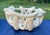Unique ceramic abstract bowl or centerpiece made with a free flowing, woven design in a creamy off-white color with a...