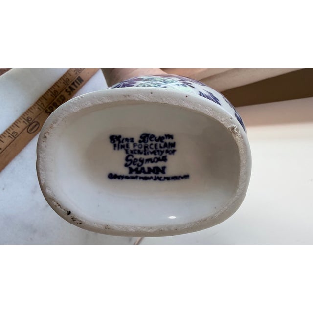 Elevate your tabletop, mantel, or shelving display with this charming vintage fine porcelain vase from the "China Blue"...