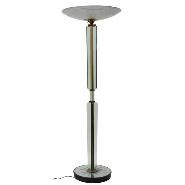 Floor lamp in grinded glass and mirrored glass, with base in wood and structure in brass. Designed by Luigi Brosotti in...