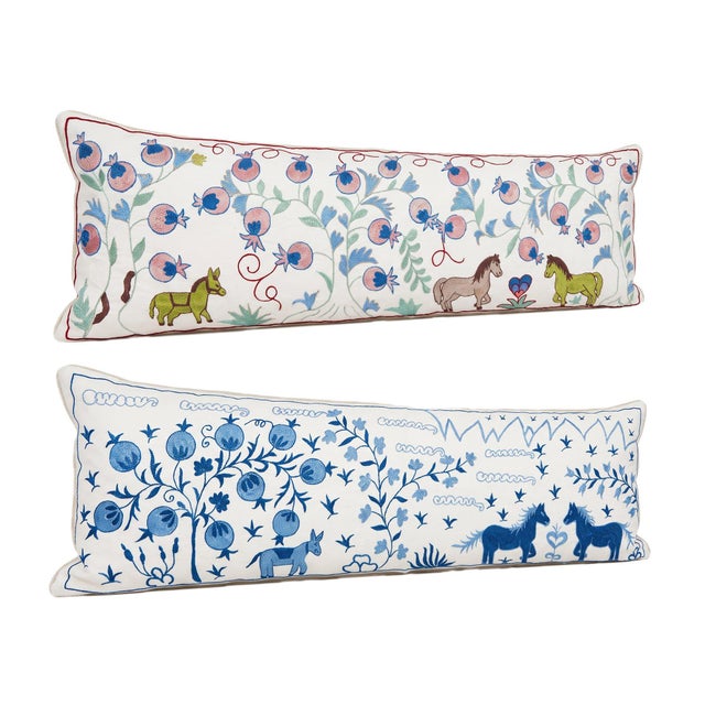 This beautiful 18'' x 54'' hand-embroidered Suzani pillow cover set was made from authentic Uzbek cotton fabric. The...