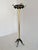 An elegant Italian coat rack dating from the 1950s, beautifully crafted from warm aged brass combined with black lacquered...