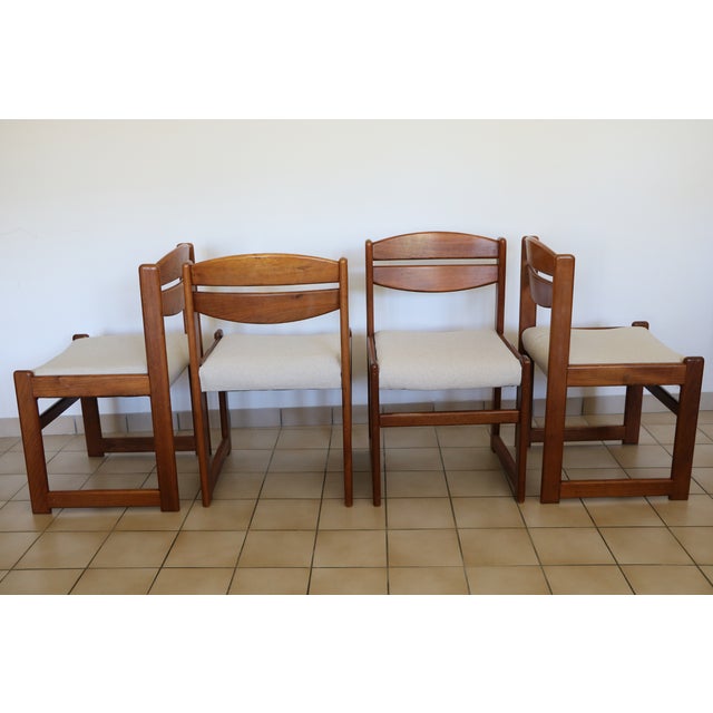 Four vintage wooden chairs with reupholstered seats in a cotton/linen fabric made in France. In excellent condition...