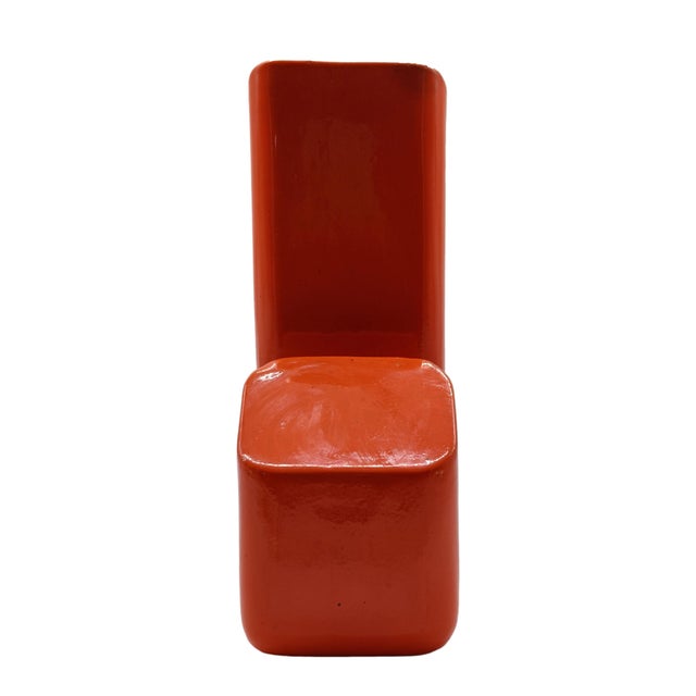 A collectable orange glazed ceramic vase by Capodario, renowned for its avant-garde, geometric design typical of 1970s...