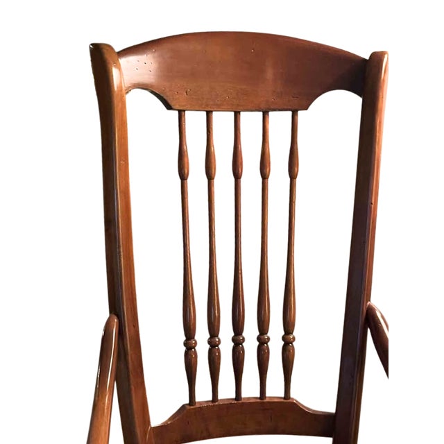 Crafted from richly grained yew wood, this charming gooseneck rocking chair combines timeless craftsmanship with classic...