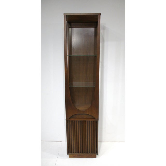A rare unique dark walnut toned display or entrance way cabinet, 2-piece configuration with the top having two...