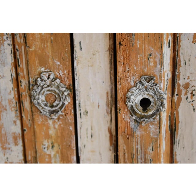 This buffet deux corps boasts a scraped finish that gives it a unique textured appearance, enhancing its antique charm and...