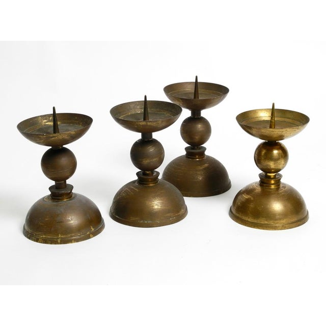 Four large heavy Mid Century Brass candlesticks. For decades they stood in a Bavarian church. Entirely made of solid...