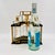 Vintage Mid-Century Modern locking tantalus decanter set. Also known as a liquor caddy or portable bar, featuring three...