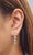 These elegant 2.02 ct diamond dangle earrings are beautifully crafted in 14k white gold, featuring eight sparkling round...