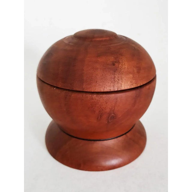 Offered is an artisan crafted Teak wood spherical tobacco / spice / shaving cream jar that has a round Walnut wood base....