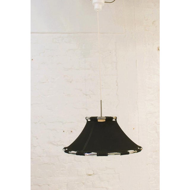 "Anna" pendant light designed by Anna Ehrner for Ateljé Lyktan Made with 2 chrome tubular circles and a black colored...